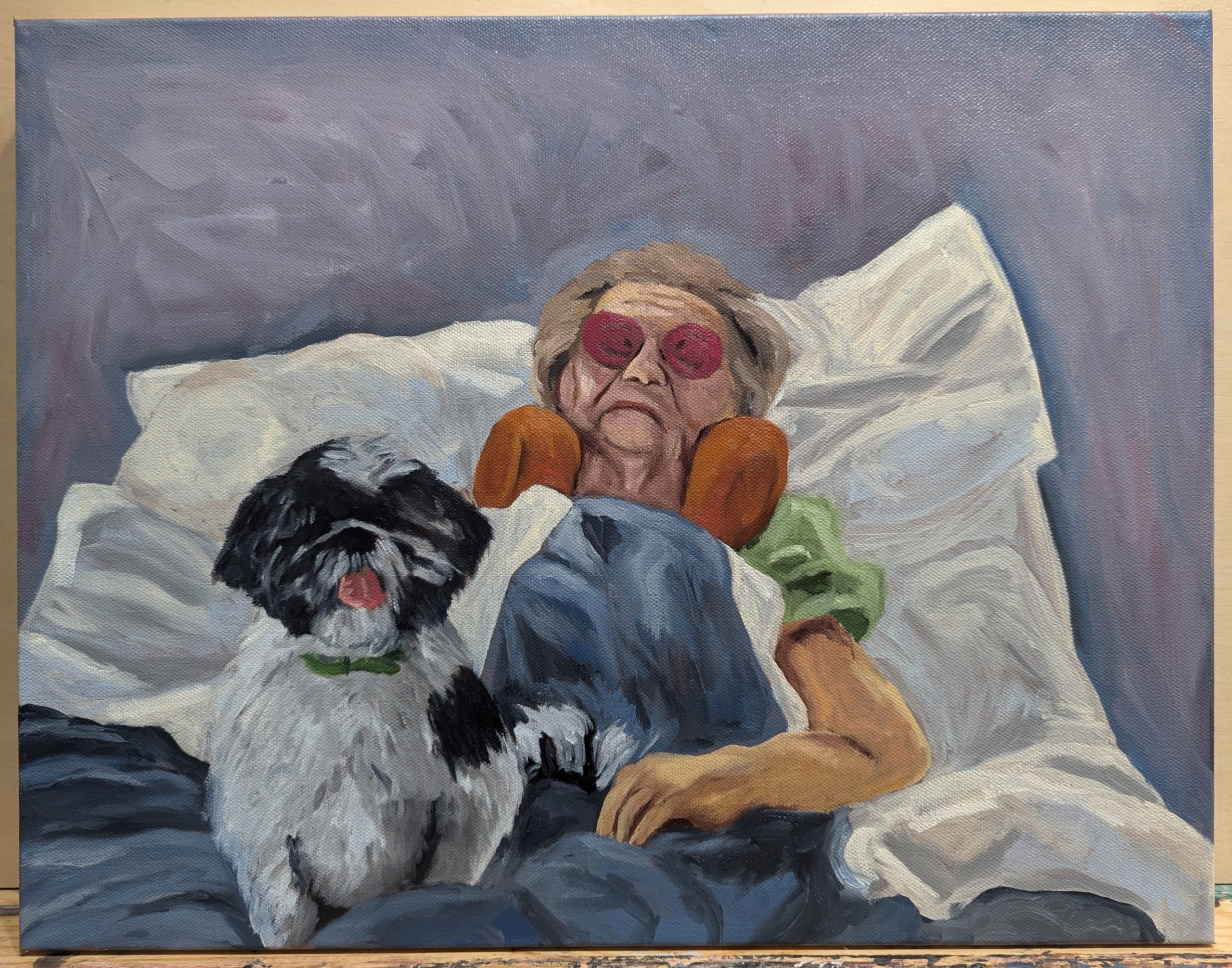 Oil painting of my grandma in a hospital bead with her animal companion Berkley.