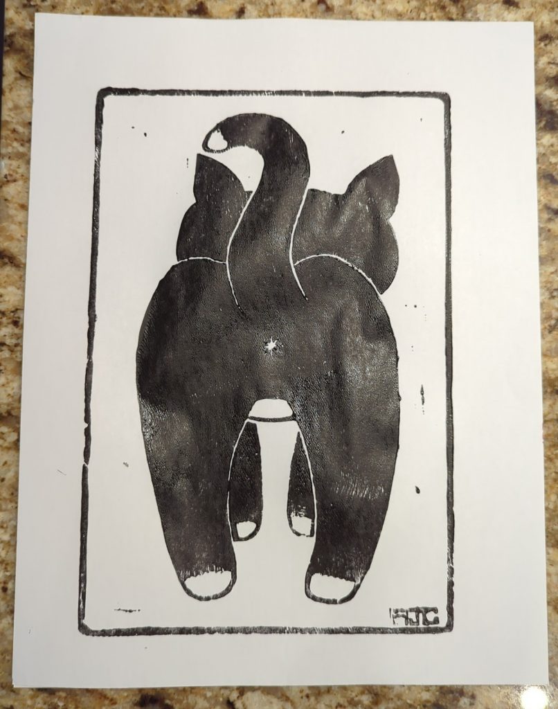 Acrylic proof of a linocut showing a cat from behind. Print is in black on white paper.