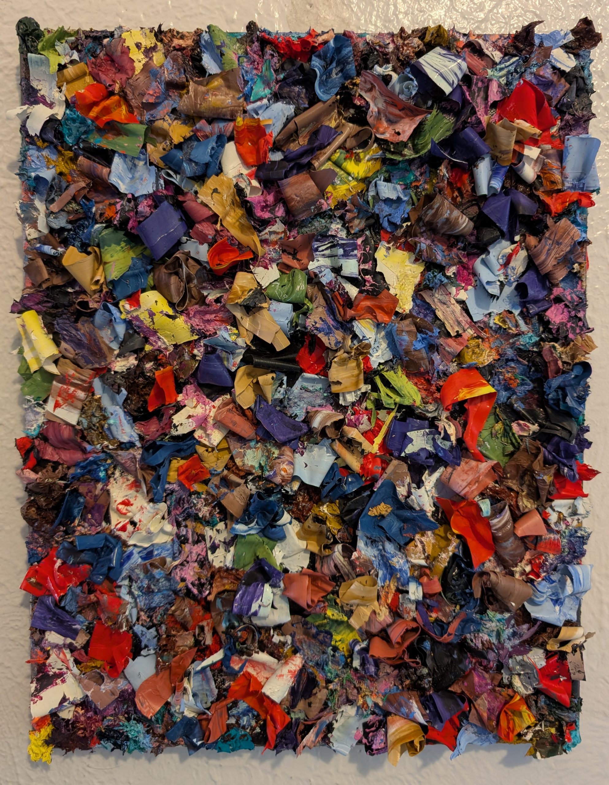 Thick ribbons and artifacts of oil paint on canvas. Abstract.